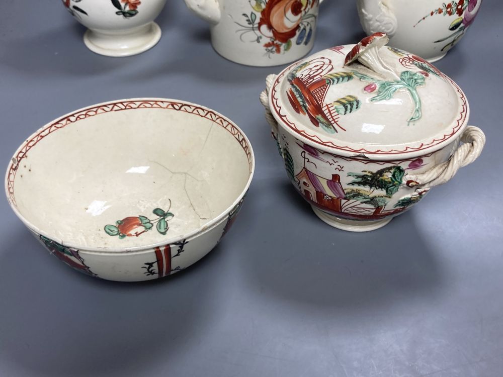 A collection of nine pieces of late 18th century creamware, including bullet-shaped teapot, 11cm high and four tea canisters with silve